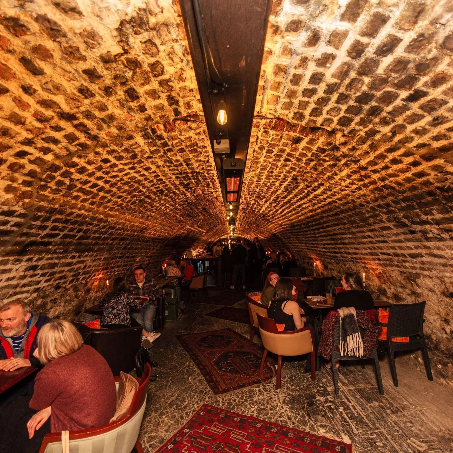 Arched brick tunnel interior of The Old Workshop cocktail bar on Shiprow, Aberdeen